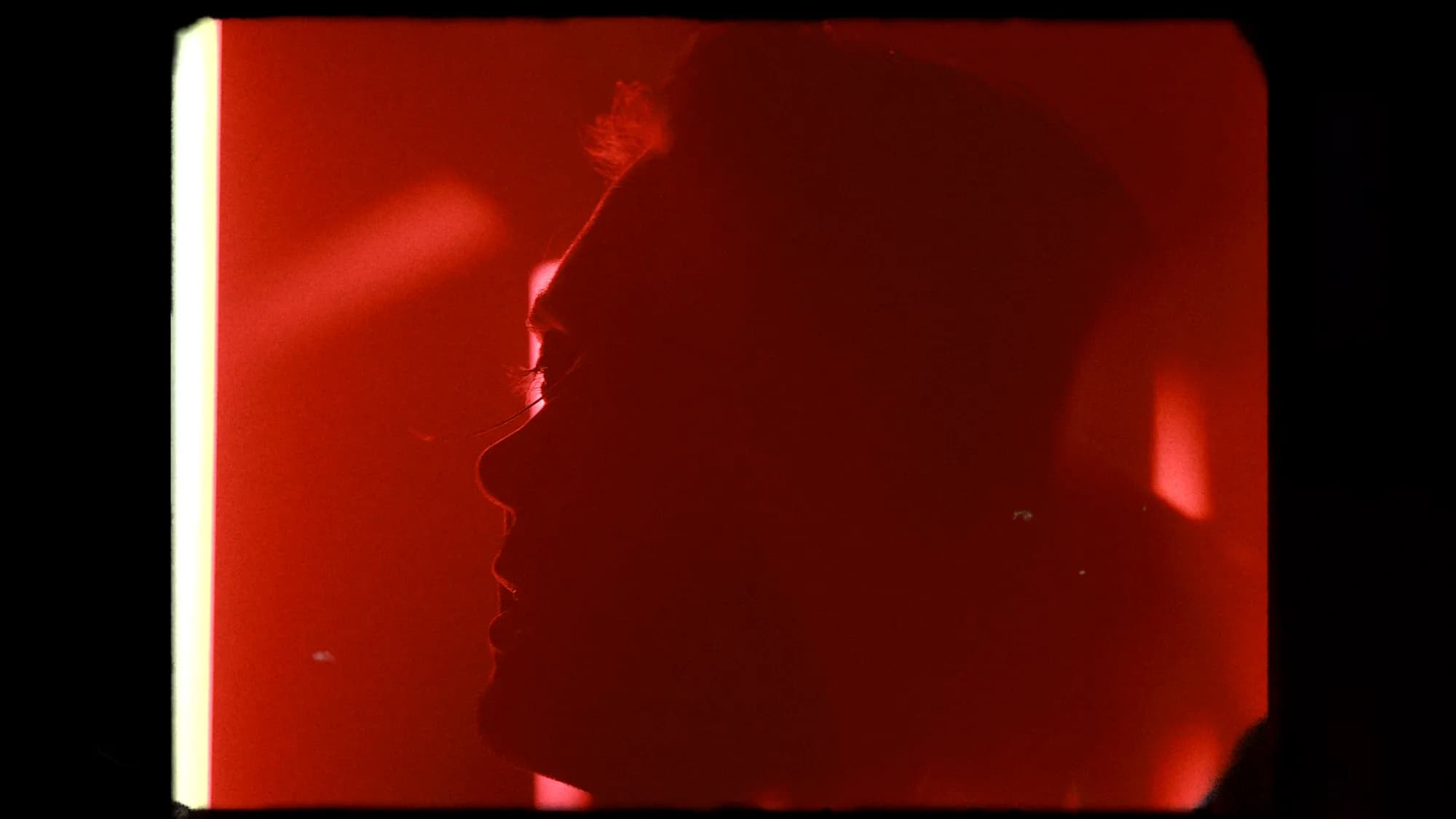 Peace Tonight – film frame, profile in deep red