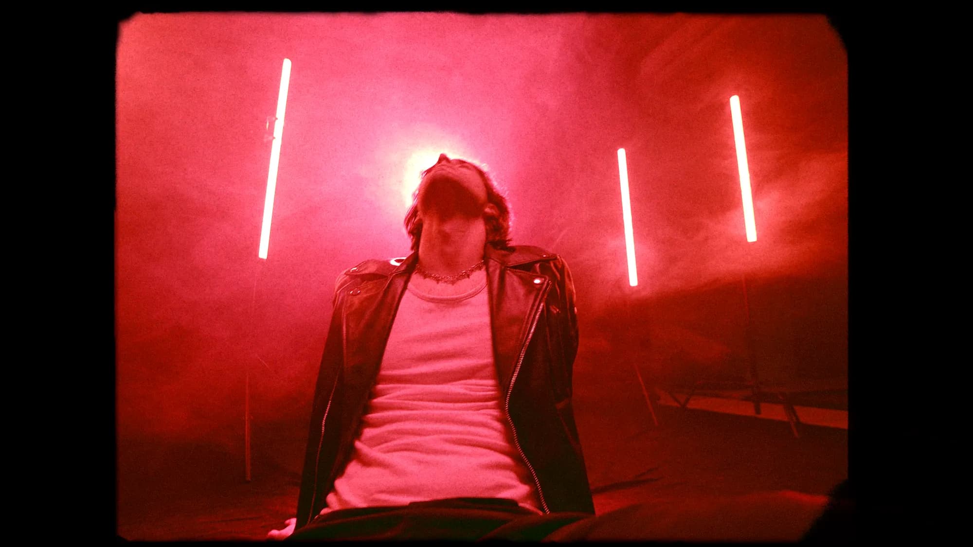 Peace Tonight – film frame, head tilted into the halo